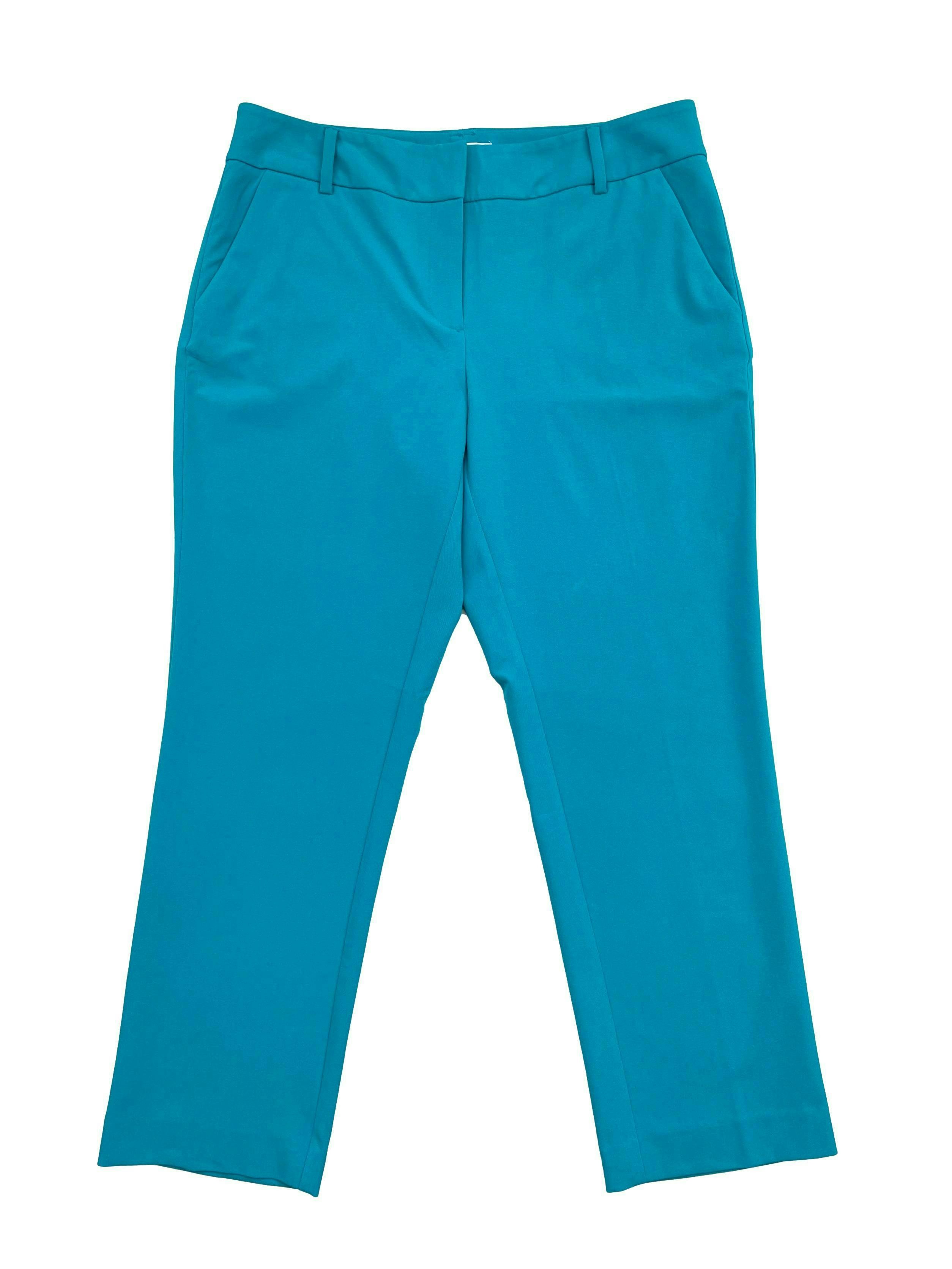 Pantalón NYC turquesa estilo formal, tiro medio y corte slim. Cintura 80cm Largo 89cm