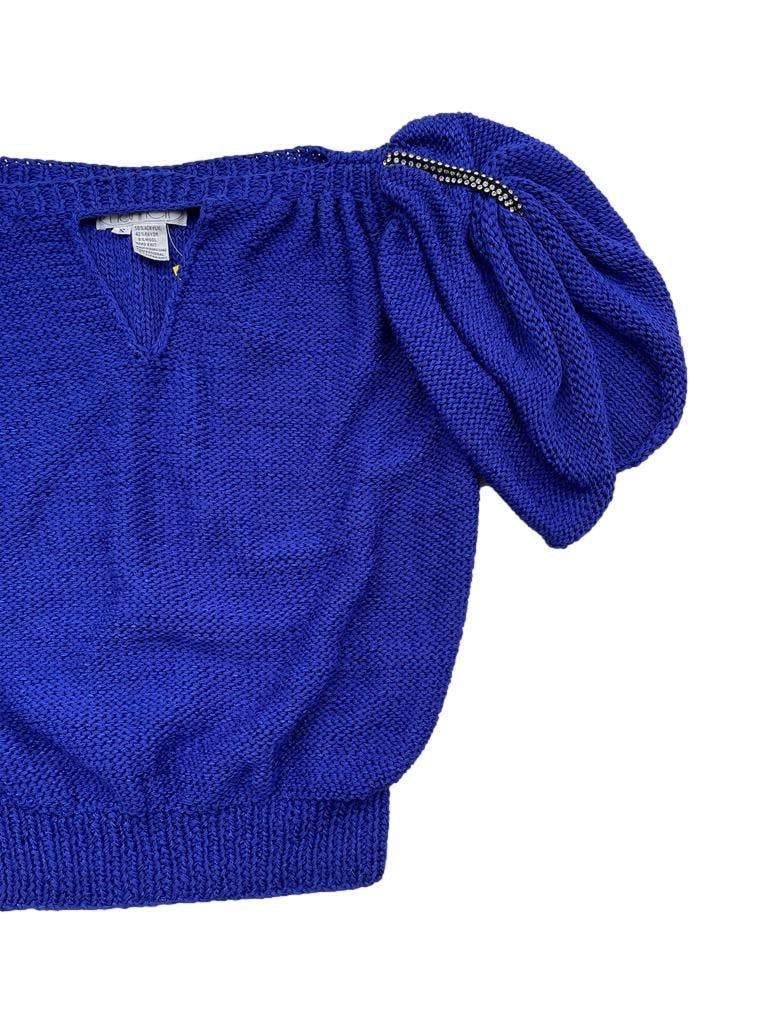 Chompa vinatge Nannel azul, mangas abullonadas con tiras de strass en los hombros. Busto 100cm Largo 48cm. Una pieza de los 80s