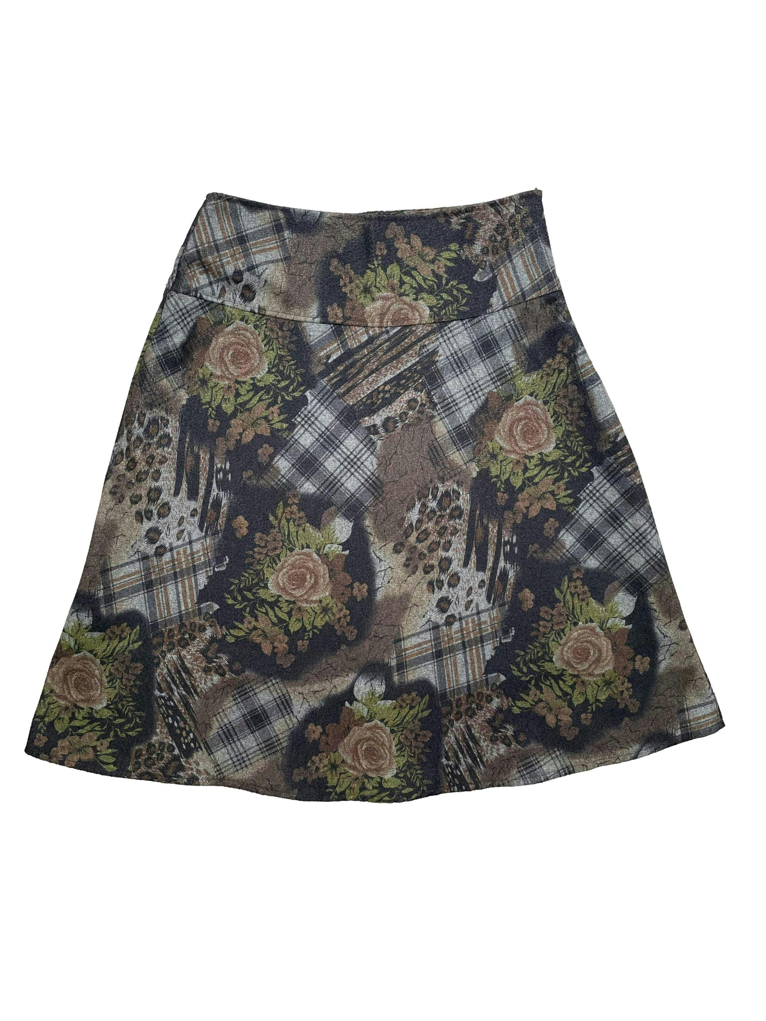 Falda de lanilla en tonos tierra con estampado floral y a cuadros. Con forro , pretina alta y cierre invisible lateral. Cintura 72cm, Largo 63cm.