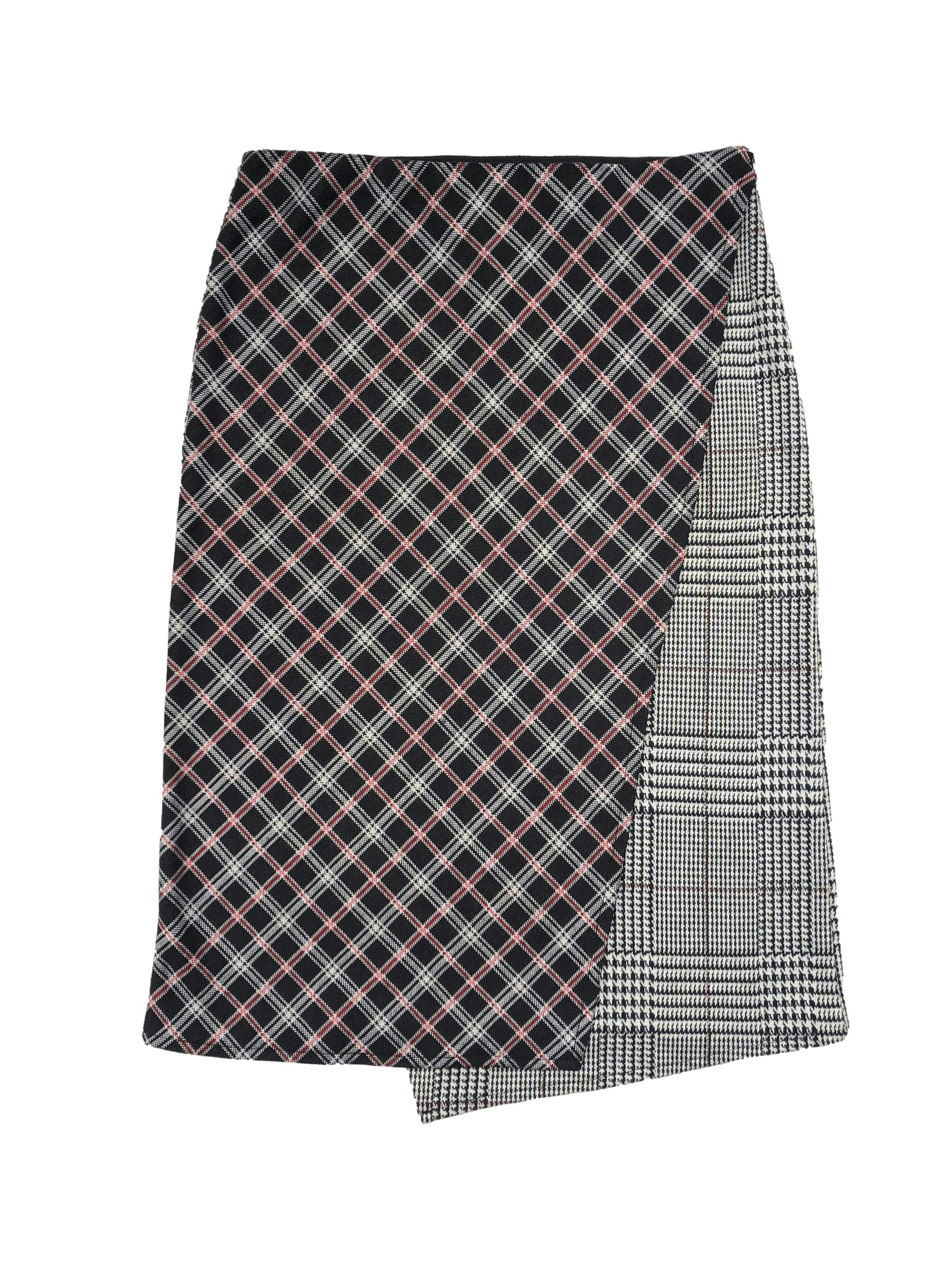 Falda midi Zara con cruce frontal, mix de estampados a cuadros en blanco, negro y rojo, tela de punto con elástico en pretina. Cintura 74cm sin estirar, Largo 63cm.