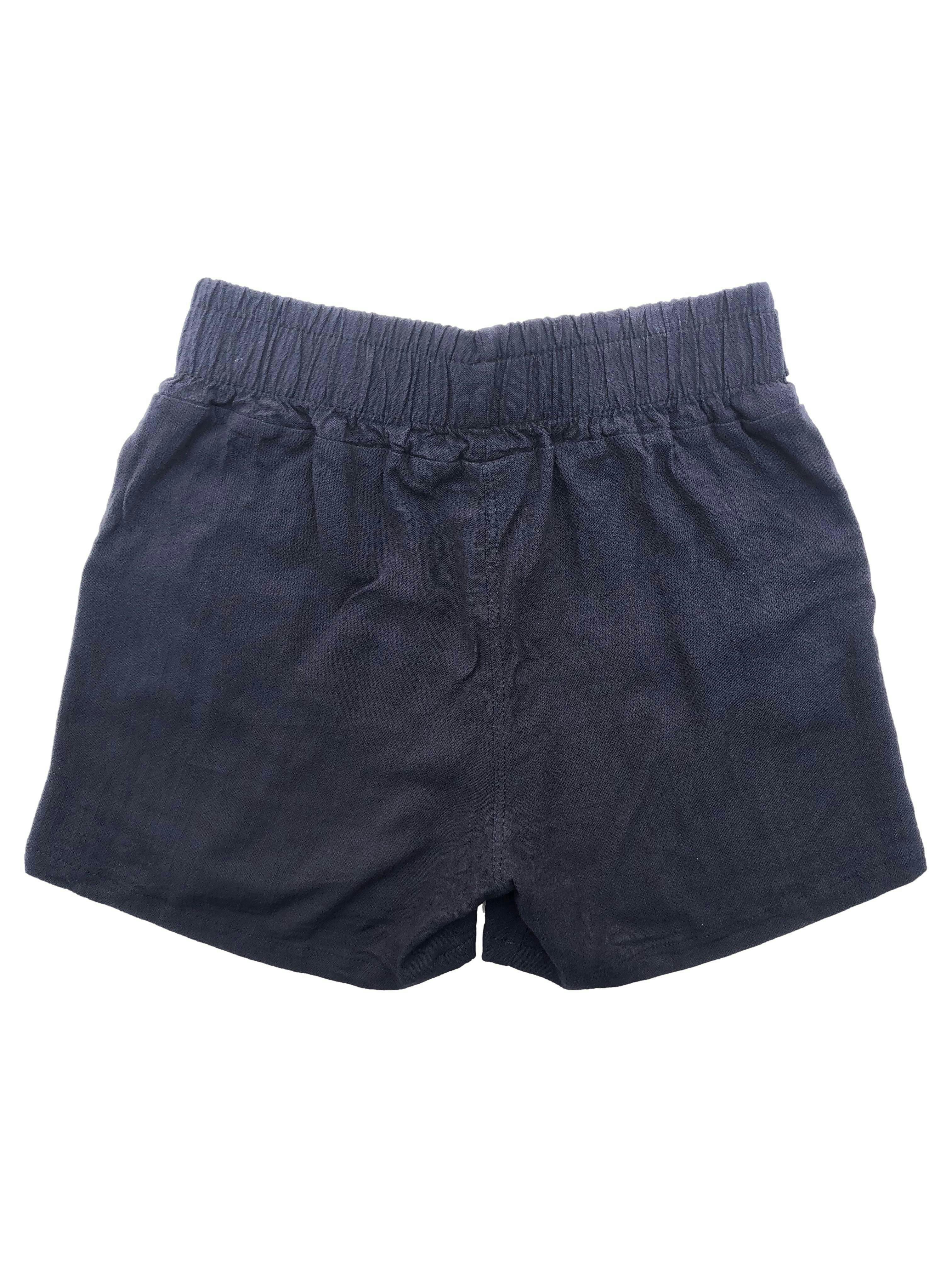 Short azul oscuro tela tipo lino con pretina elástica, cintos y bolsillos. Cintura 60cm sin estirar, Largo 30cm.