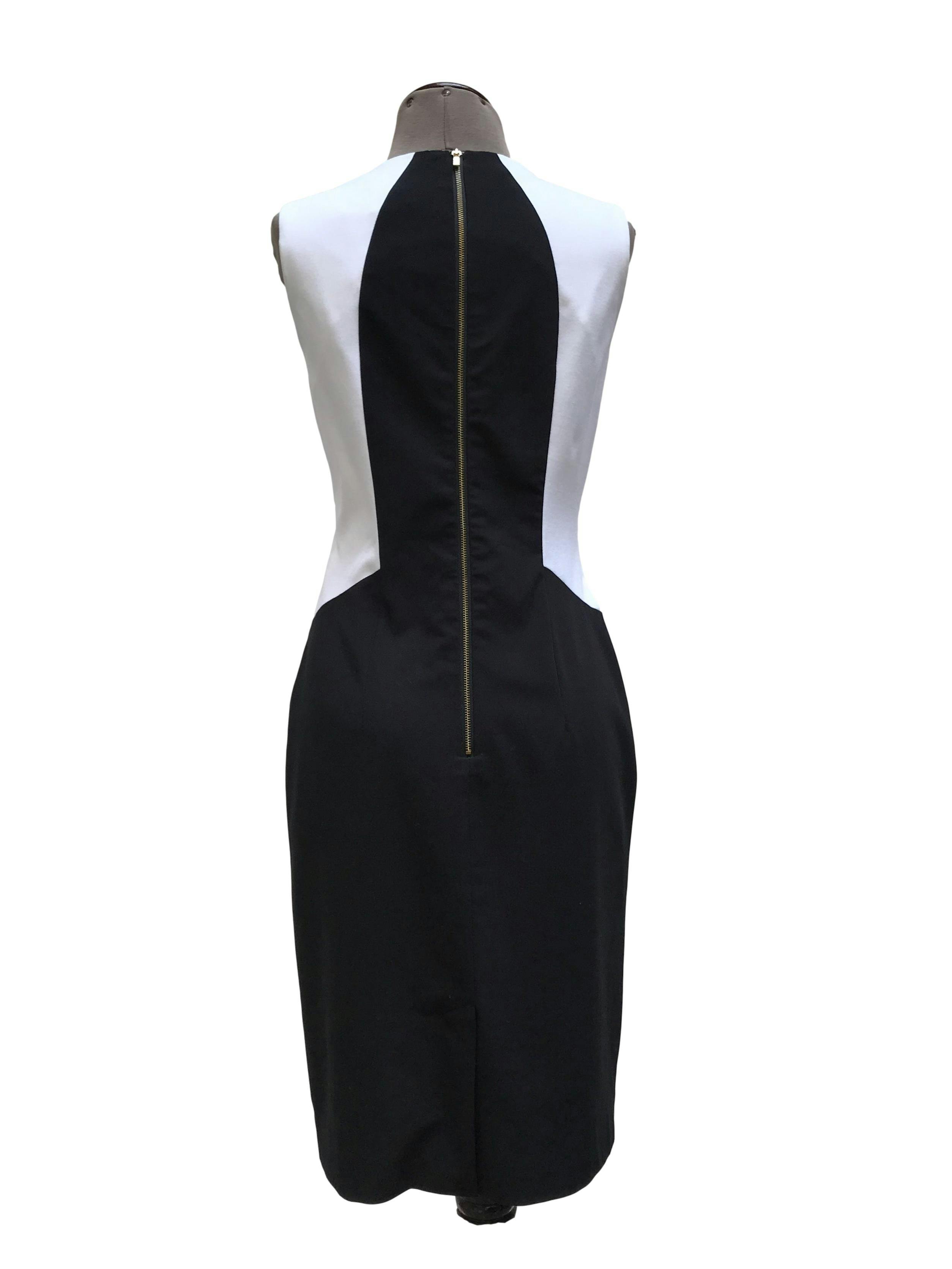 Vestido Calvin Klein tela tipo sastre negro, blanco y turquesa, forrado, con cierre posterior. Precio original S/ 420. Busto 92cm Largo 95cm