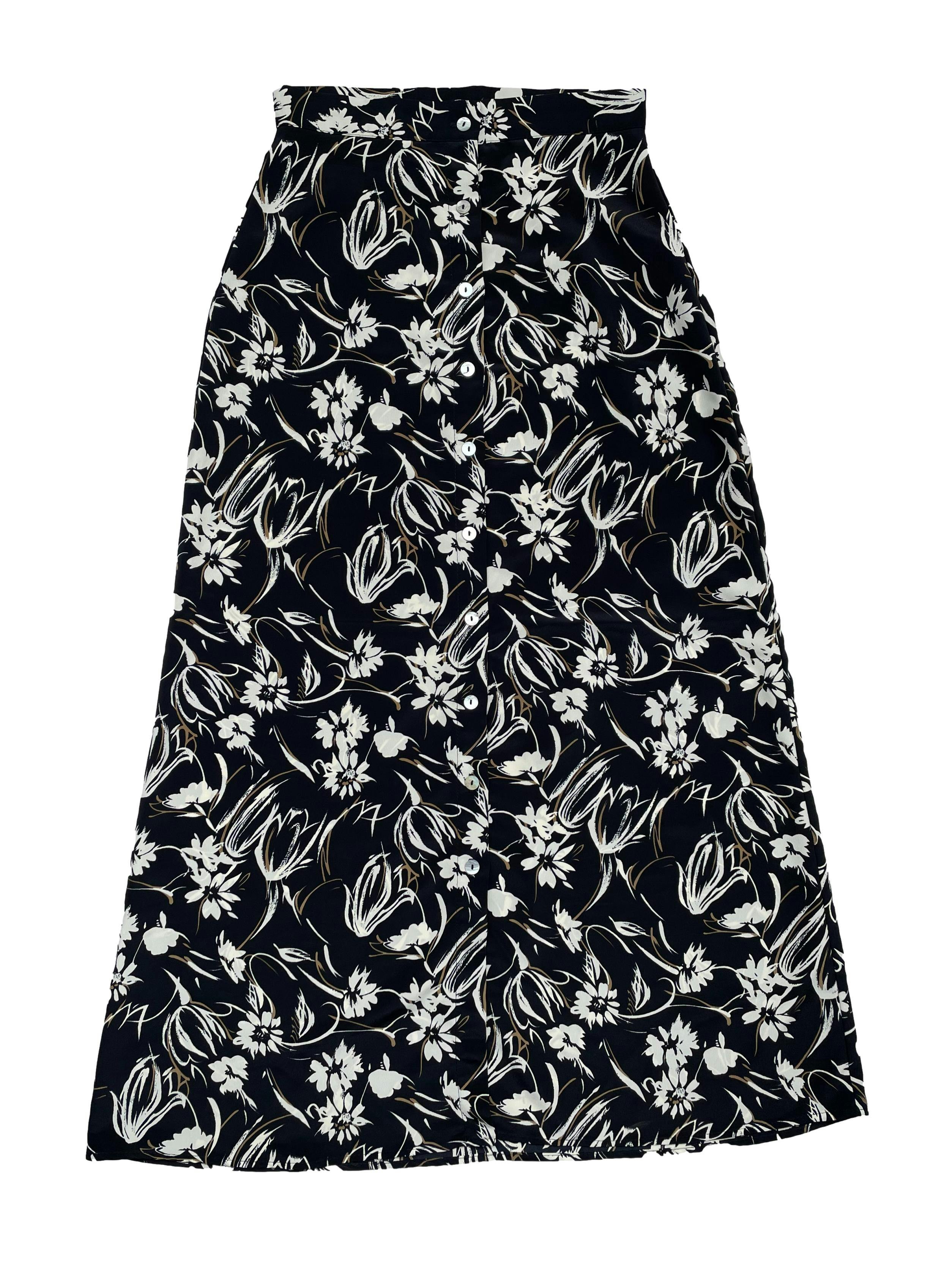 Falda vintage tela plana negra con flores crema y beige, fila de botones nacarados delanteros, corte en A. Cintura 66cm Largo 97cm