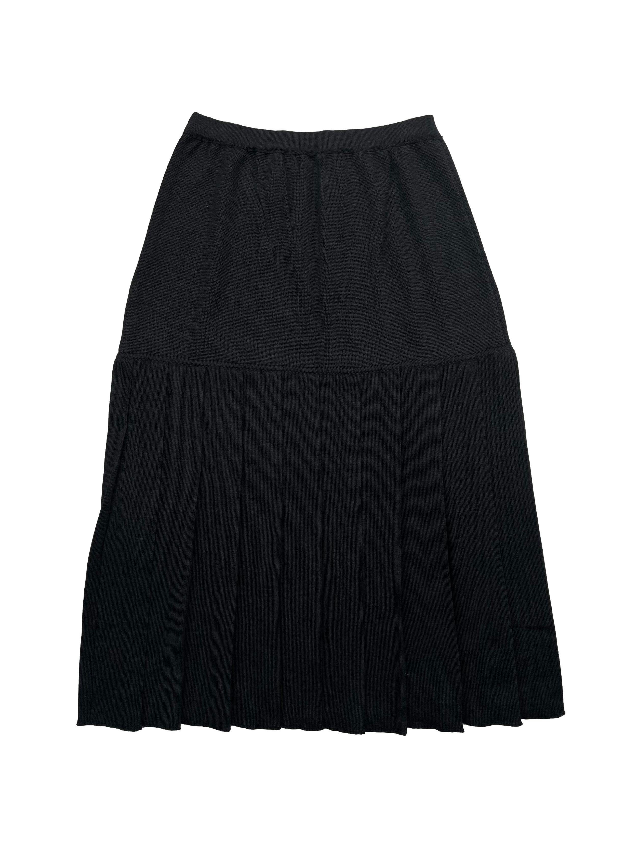 Falda vintage negra de punto , parte baja plisada con cintura elástica. Cintura 66cm sin estirar, Largo 72cm.