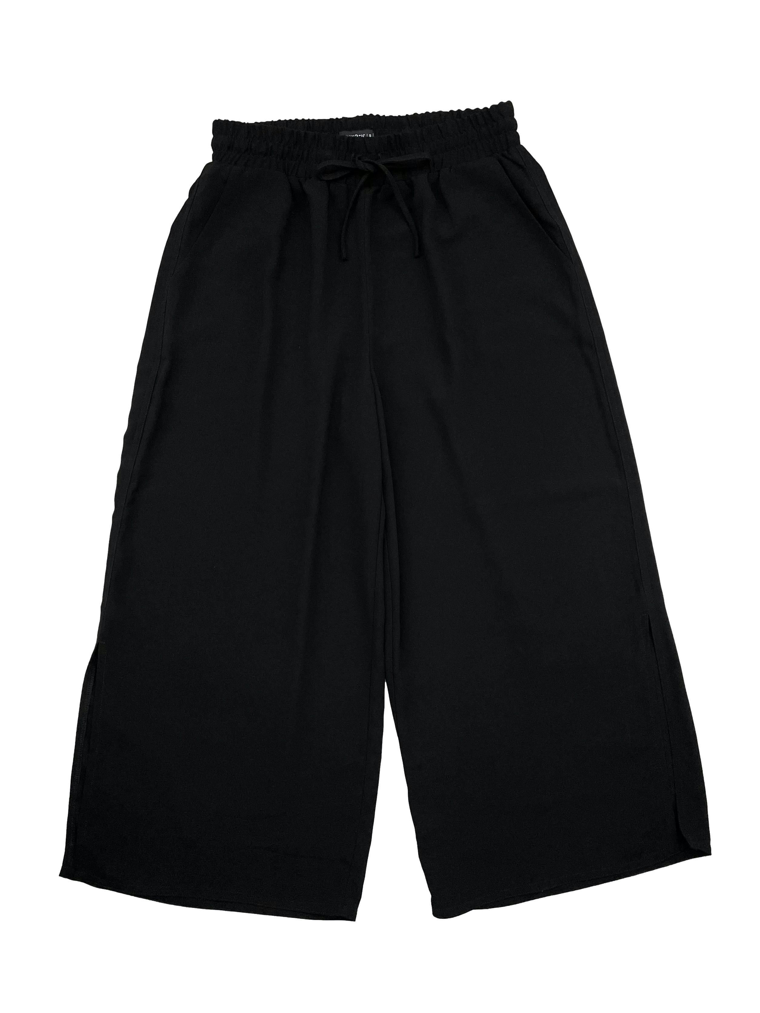 Culotte negro Hypnotic con elástico y cordones en cintura, bolsillos y aberturas laterales. Cintura 70cm, Largo 88cm.