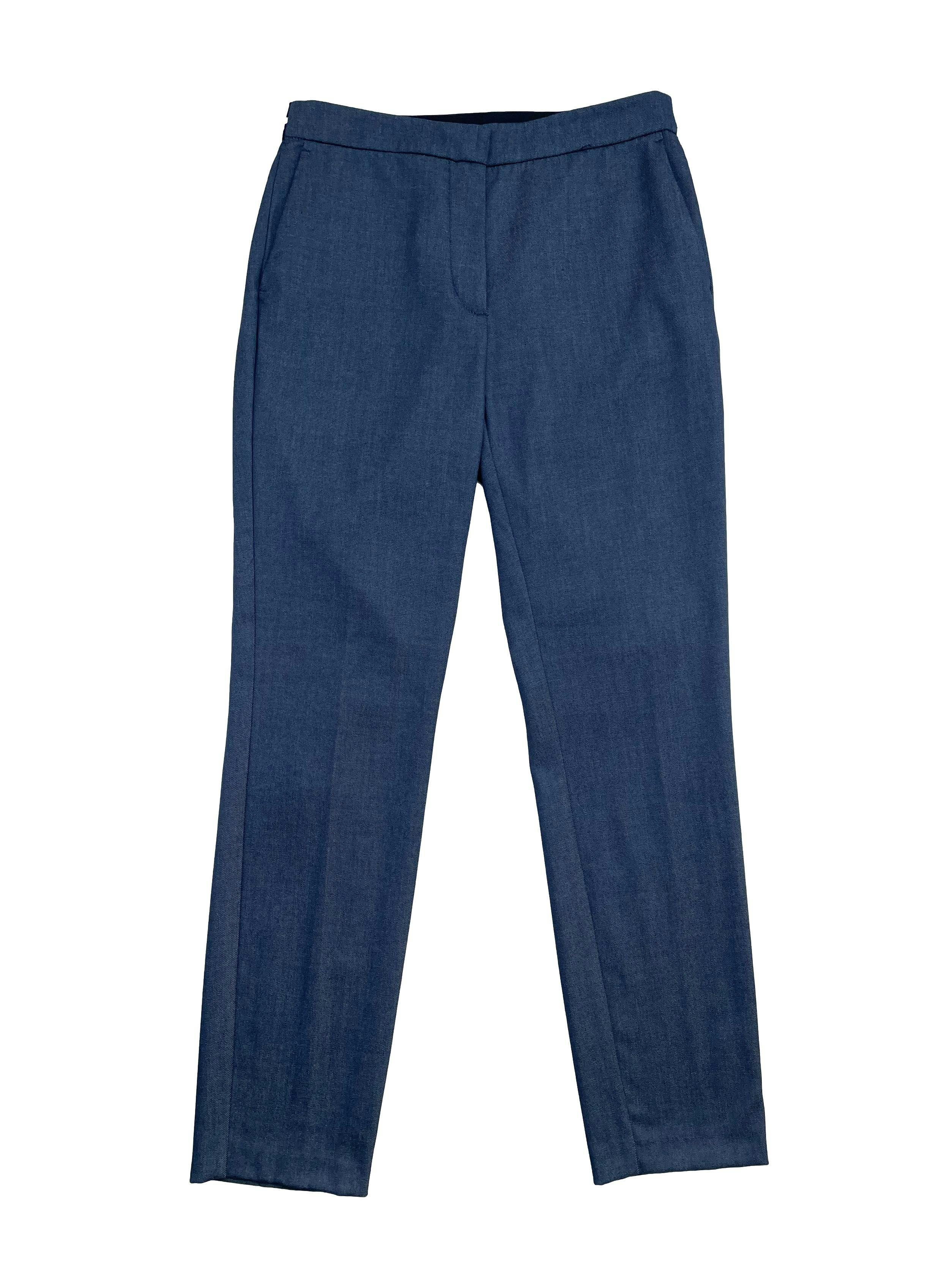 Pantalón Zara azul tipo jean con elástico posterior enla pretina, cierre, botón y bolsillos delanteros. Cintura: 72cm (sin estirar), Tiro 24cm Largo: 94cm