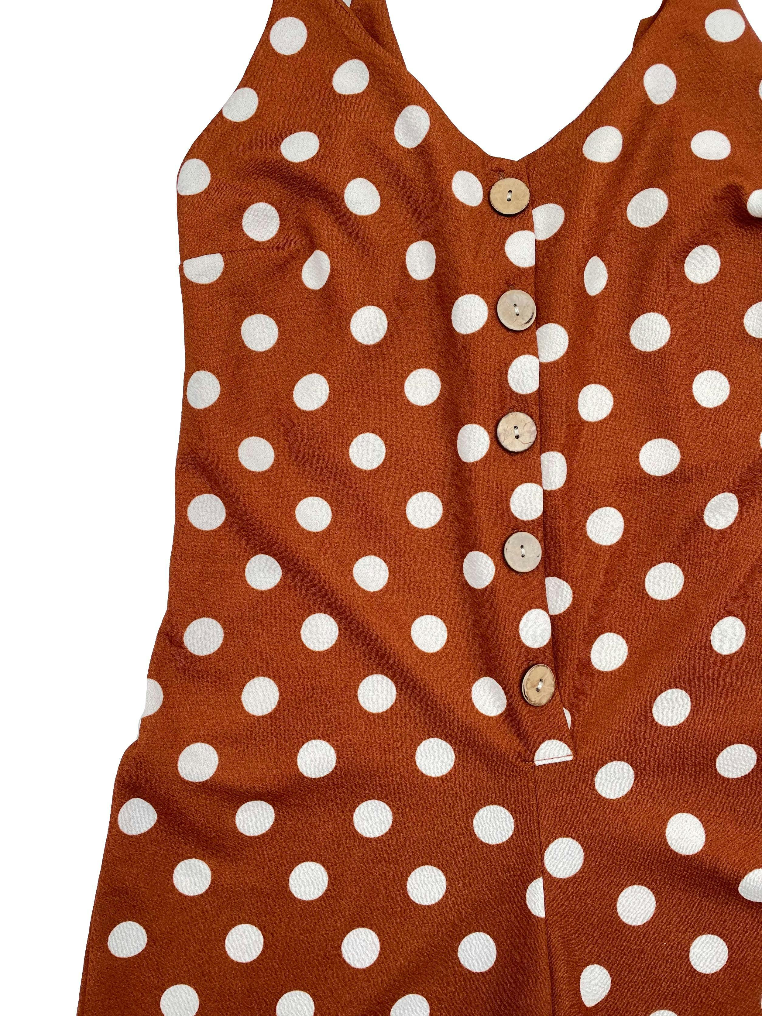 Enterizo Bo´hem color ladrillo con polka dots blancos, tirantes regulables, botones frontales, parte inferior tipo culotte. Busto 80cm, Largo 120cm.