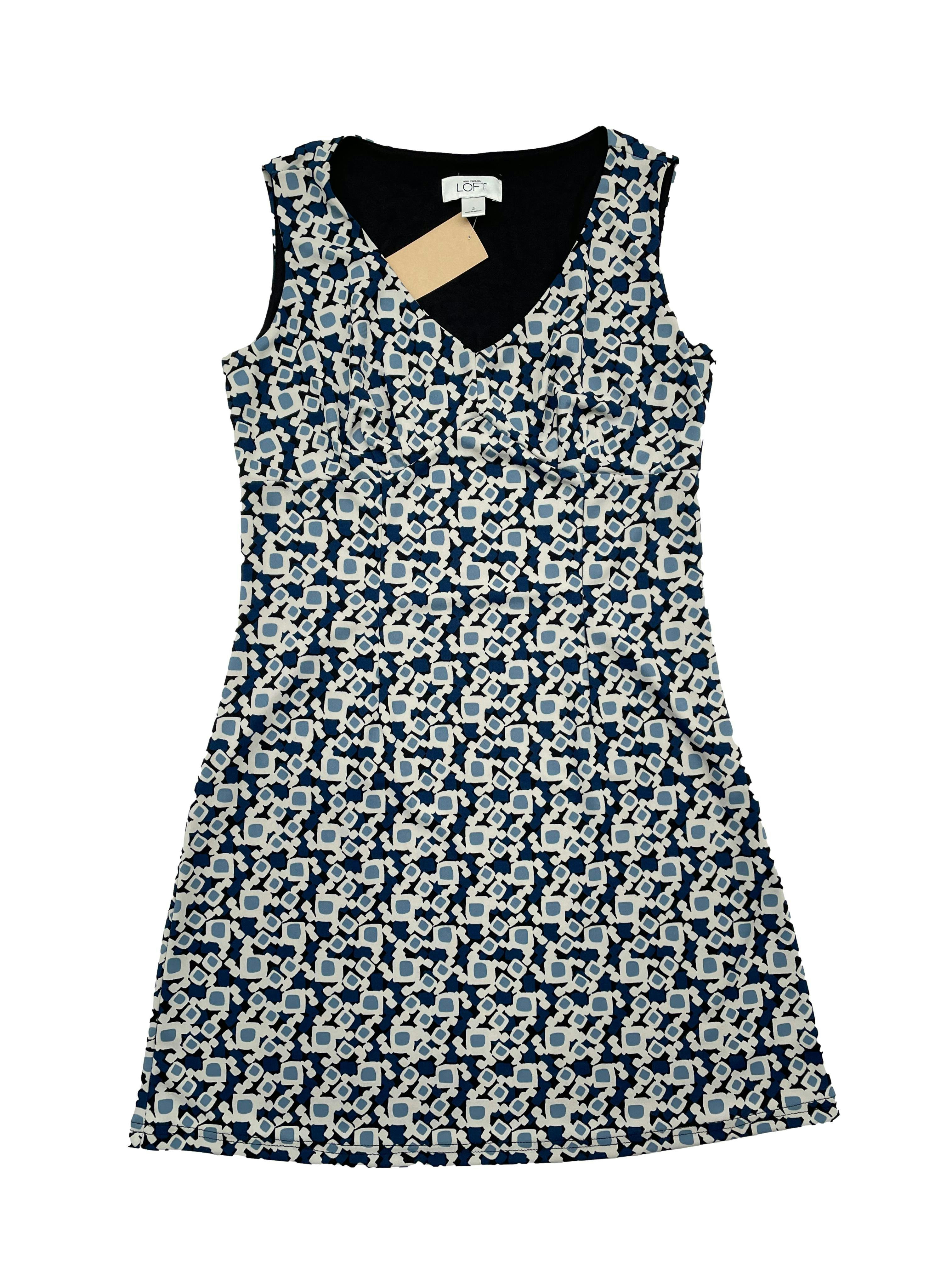 Vestido Ann Taylor Loft estampado en tonos azules con forro, escote en V, pliegues en busto, pinzas y cierre lateral invisible. Busto 90 cm, Largo 80cm.