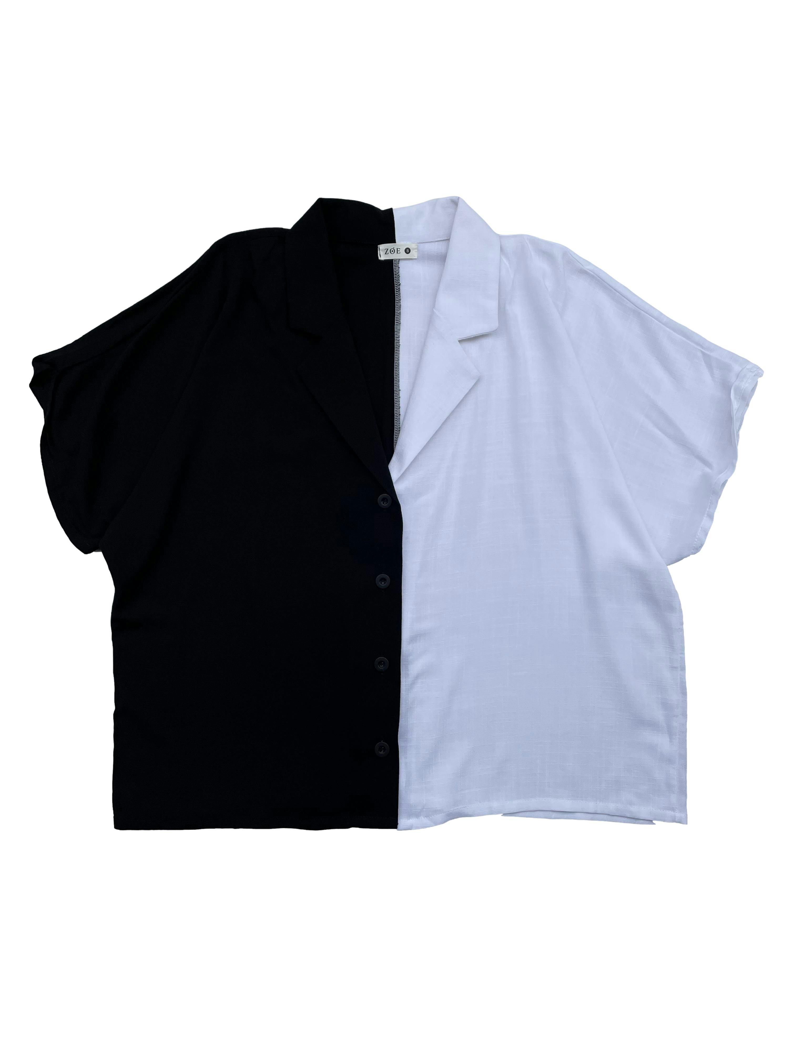 Blusa oversized Zoe color block blanco y negro, tela con caída, cuello cubano y botones. Busto 120cm Largo 60cm