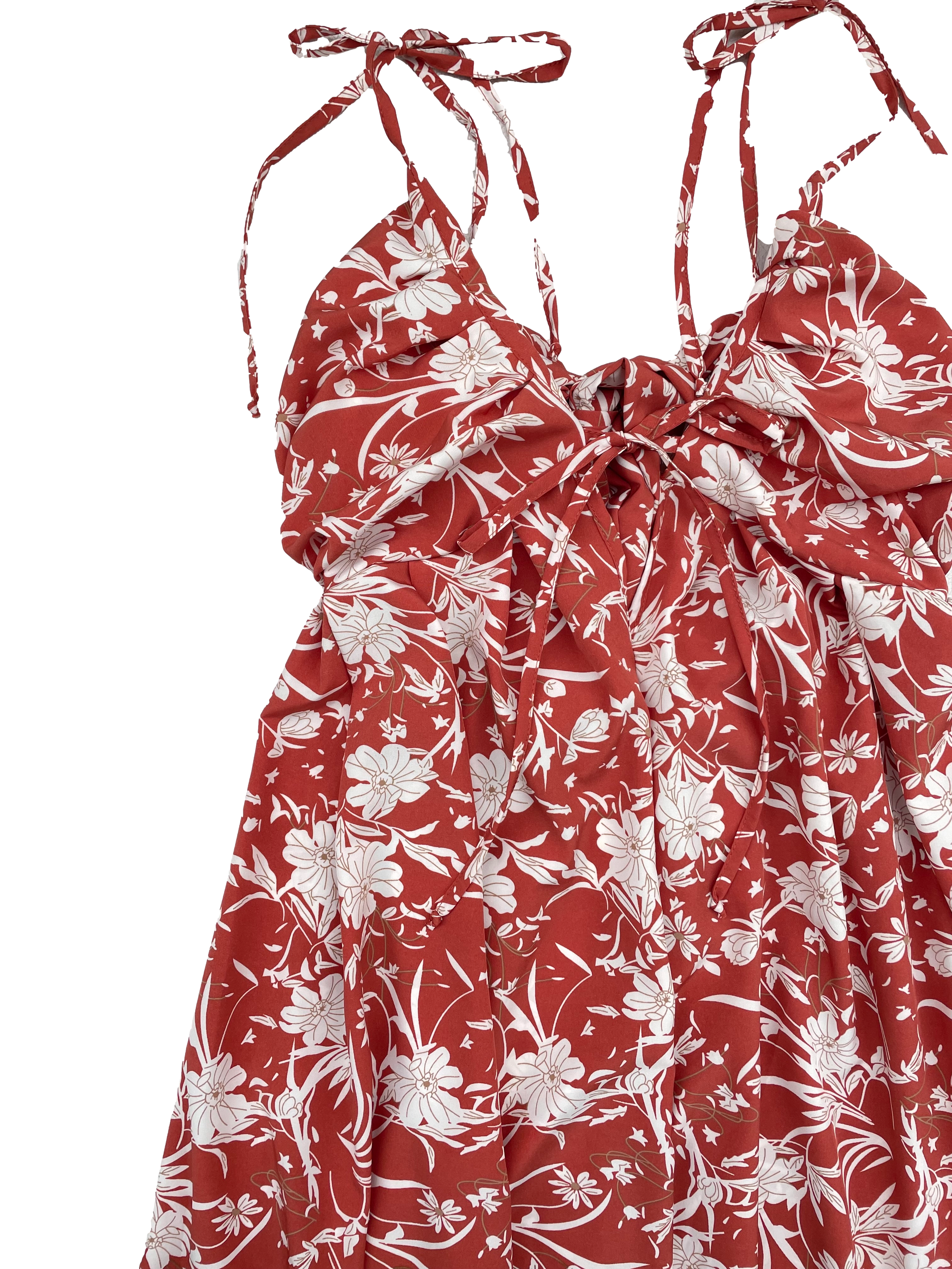 Vestido Bohem tela plana fluida ladrillo con flores crema, se amarra en hombros, espalda y busto, cintura con elástico posterior y falda amplia. Largo 135cm. Nuevo con etiqueta.
