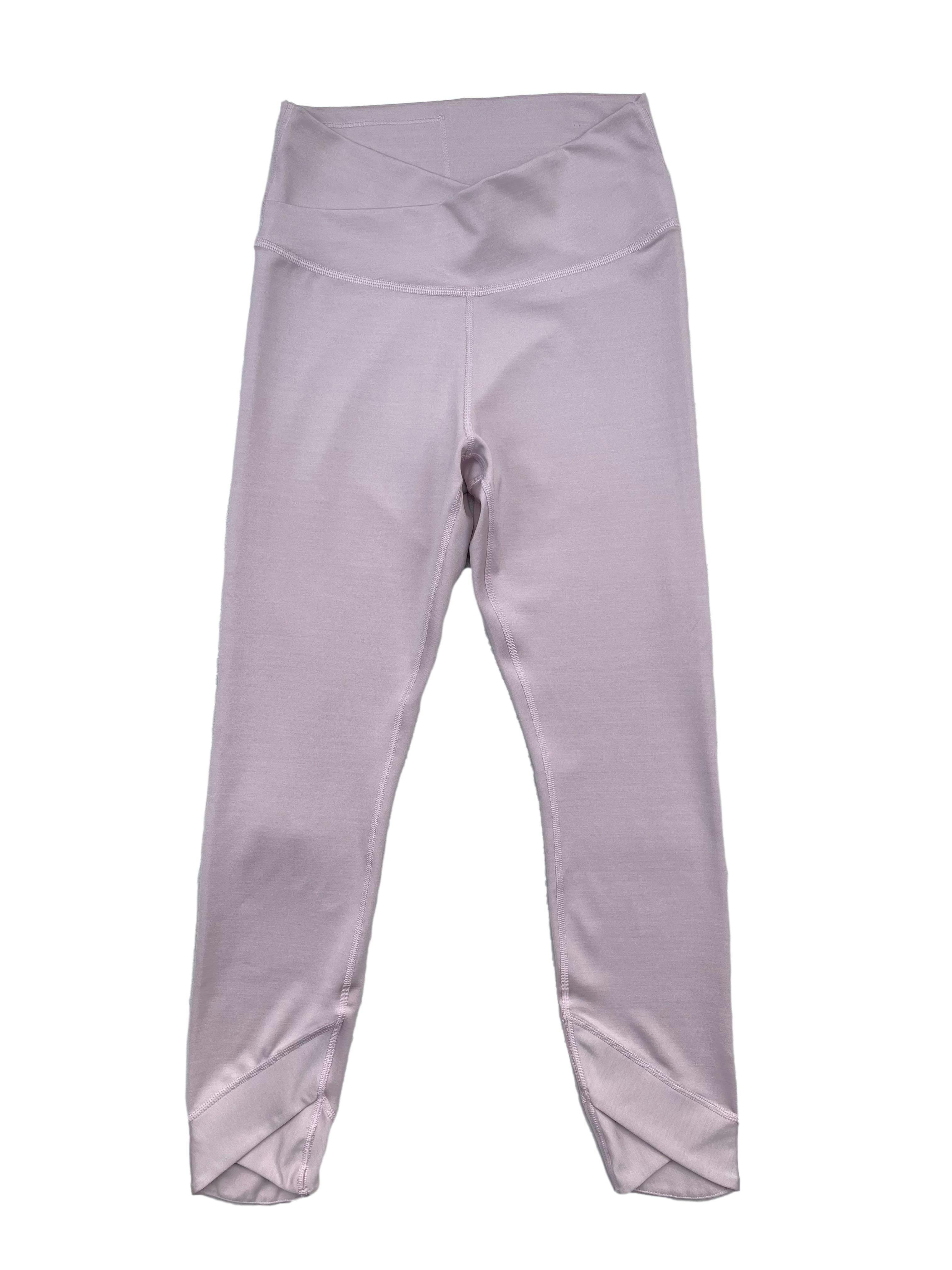 Leggings palo rosa Nike, pretina y tobillos con cruce en V, bolsillo interno, teconología Dri-Fit que absorve el sudor. Cintura 60cm sin estirar, Largo 85cm.